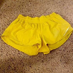Yellow 2.5” Lululemon hotty hot shorts size 4